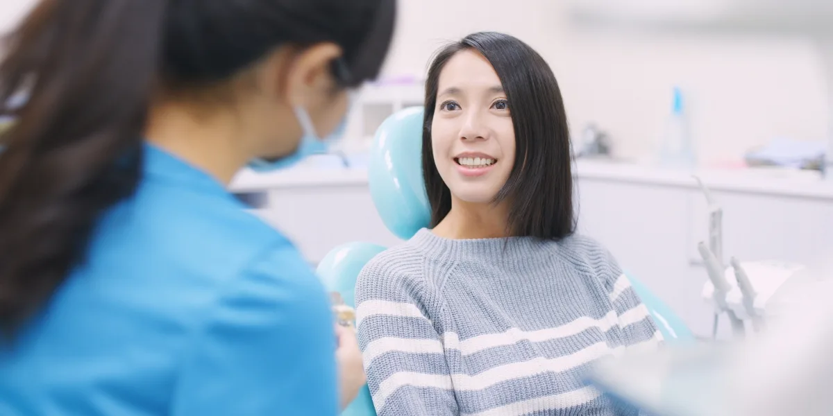 Female at Oral Surgeon Office Discussing Sedation